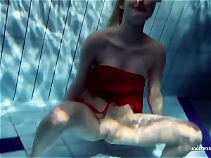 warm ash-blonde Lucie French teenager in the pool