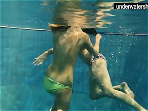 2 sexy amateurs showing their bodies off under water